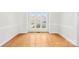 Bright and airy living room featuring hardwood floors, natural light, and neutral decor at 14500 Harvington Dr, Huntersville, NC 28078
