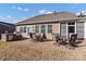 Spacious backyard features a patio with outdoor seating and a built-in grill at 16812 Lookout Landing Ln, Charlotte, NC 28278