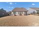 Spacious backyard features a patio with outdoor seating and a built-in grill at 16812 Lookout Landing Ln, Charlotte, NC 28278