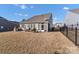 Spacious backyard features a patio with outdoor seating and a built-in grill at 16812 Lookout Landing Ln, Charlotte, NC 28278