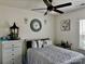 Comfortable bedroom with a decorative ceiling fan, stylish decor, and an abundance of natural light at 16812 Lookout Landing Ln, Charlotte, NC 28278
