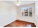 Bright bedroom featuring hardwood floors and a large window with neighborhood views at 16812 Lookout Landing Ln, Charlotte, NC 28278