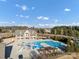 Large community pool with a slide, splash pad, and plenty of seating at 16812 Lookout Landing Ln, Charlotte, NC 28278