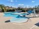 Large community pool with a slide, splash pad, and plenty of seating at 16812 Lookout Landing Ln, Charlotte, NC 28278