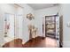 Inviting foyer with hardwood floors, decorative accents, and a stylish front door at 16812 Lookout Landing Ln, Charlotte, NC 28278