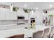Modern kitchen with a large island, white cabinetry, and stainless steel appliances at 16812 Lookout Landing Ln, Charlotte, NC 28278