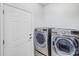 Convenient laundry room with modern washer and dryer appliances at 16812 Lookout Landing Ln, Charlotte, NC 28278