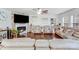 Spacious living room features a stone fireplace, hardwood floors, and comfortable leather furniture at 16812 Lookout Landing Ln, Charlotte, NC 28278