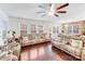 Spacious living room featuring hardwood floors, large windows, and comfortable seating at 16812 Lookout Landing Ln, Charlotte, NC 28278