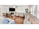 Cozy living room with a fireplace, hardwood floors, and comfortable seating at 16812 Lookout Landing Ln, Charlotte, NC 28278