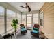 Enclosed sunroom featuring lots of windows and comfortable seating at 16812 Lookout Landing Ln, Charlotte, NC 28278