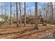 Wonderful home in a wooded setting features a spacious lawn and a charming exterior at 1703 Fairway Dr, Newton, NC 28658