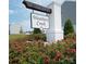 Weather Creek community entrance with brick sign and beautiful landscaping at 171 Crownpiece St, Troutman, NC 28166