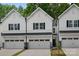 Townhomes feature modern architecture, black accents and attached garages at 19765 Feriba Pl, Cornelius, NC 28031