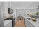 Modern kitchen flows into the dining and living areas, perfect for entertaining at 19765 Feriba Pl, Cornelius, NC 28031