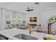 Open-concept living space with a kitchen island and modern furnishings at 19765 Feriba Pl, Cornelius, NC 28031