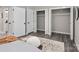 Bedroom with double closets and gray flooring at 2000 Patio Ct # 108, Charlotte, NC 28205