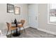 Small dining area near the entryway with two chairs at 2000 Patio Ct # 108, Charlotte, NC 28205