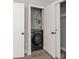 Compact laundry closet with stacked washer and dryer at 2000 Patio Ct # 108, Charlotte, NC 28205