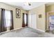 Bright bedroom with double doors and carpet flooring at 2104 Congress Ct, Kannapolis, NC 28083