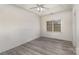 Bedroom with grey laminate floors, ceiling fan and window at 2134 Pinefield Ct, Gastonia, NC 28056