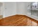 Spacious bedroom with hardwood floors and large window at 237 Northwest Dr, Davidson, NC 28036