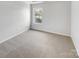 Bright bedroom with neutral walls and carpet at 3217 Ian Patrick Ave, Kannapolis, NC 28083