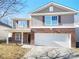 Two-story brick home with a large garage and well-maintained lawn at 3217 Ian Patrick Ave, Kannapolis, NC 28083