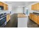 Modern kitchen with island and sliding glass doors to backyard at 3217 Ian Patrick Ave, Kannapolis, NC 28083