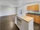 Modern kitchen with island and light wood cabinets at 3217 Ian Patrick Ave, Kannapolis, NC 28083