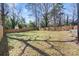 Expansive backyard with lush greenery and mature trees, offering privacy and ample space for outdoor enjoyment at 3411 Rogers St, Charlotte, NC 28208