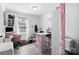 Bright bedroom featuring a desk, ample storage, and a comfortable workspace, perfect for productivity at 3411 Rogers St, Charlotte, NC 28208