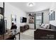 Functional bedroom with a daybed, desk, and shelving, perfect for a home office or guest room at 3411 Rogers St, Charlotte, NC 28208
