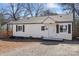 Cozy single-story home showcasing a freshly painted exterior and manicured front yard at 3411 Rogers St, Charlotte, NC 28208