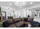 Spacious living room offering a comfortable layout, recessed lighting, and seamless flow into the dining area at 3411 Rogers St, Charlotte, NC 28208
