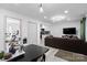 Well-lit open-concept living space showcasing a modern kitchen, living room, and dining area at 3411 Rogers St, Charlotte, NC 28208