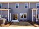 Exterior view of back of home with sliding glass doors, showing back patio and yard at 3500 Backwater St, Concord, NC 28027