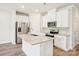 Modern kitchen with stainless steel appliances, granite countertops, and white cabinets at 3500 Backwater St, Concord, NC 28027