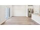 Spacious living area with hardwood floors and sliding glass doors to the backyard at 3500 Backwater St, Concord, NC 28027
