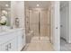 Clean bathroom with a double vanity, large shower and neutral tile at 3530 Backwater St, Concord, NC 28027