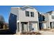 Gray and white two-story townhome with a white garage door and landscaping at 3530 Backwater St, Concord, NC 28027