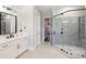 Elegant bathroom with a walk-in shower, soaking tub, and double vanity at 4311 Craig Ave, Charlotte, NC 28211
