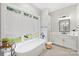Luxurious bathroom with soaking tub, double vanity, and modern fixtures at 4311 Craig Ave, Charlotte, NC 28211