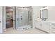 Bathroom with a walk-in shower, double vanity, and access to bedroom at 4311 Craig Ave, Charlotte, NC 28211