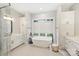 Spa-like bathroom with a freestanding tub and double vanity at 4311 Craig Ave, Charlotte, NC 28211