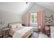 Charming bedroom with a queen bed and soft decor at 4311 Craig Ave, Charlotte, NC 28211