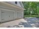 Two-car garage with light gray doors and a spacious concrete driveway at 4311 Craig Ave, Charlotte, NC 28211