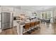 Open concept kitchen with stainless steel appliances and large island at 4311 Craig Ave, Charlotte, NC 28211