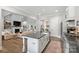 Open concept kitchen with large island and views into Gathering room at 4311 Craig Ave, Charlotte, NC 28211