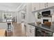 Open concept kitchen with island and wine cooler; views of Gathering room at 4311 Craig Ave, Charlotte, NC 28211